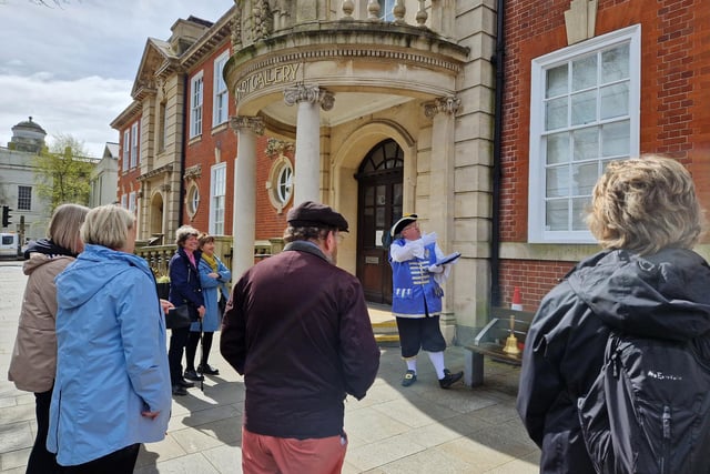 Worthing town crier Bob Smytherman launched his new walk on Tuesday, April 2, followed by afternoon tea at Worthing Town Hall to raise money for the mayor's charities, Broadwater Support Group and Community Hub, CYCALL inclusive cycling and the Parkinson's UK Worthing and Washington Group. Using information provided by The Worthing Society, Bob led a group of around 20 people on a three-hour walk around the town centre and seafront, giving many stories of the area's history en route.