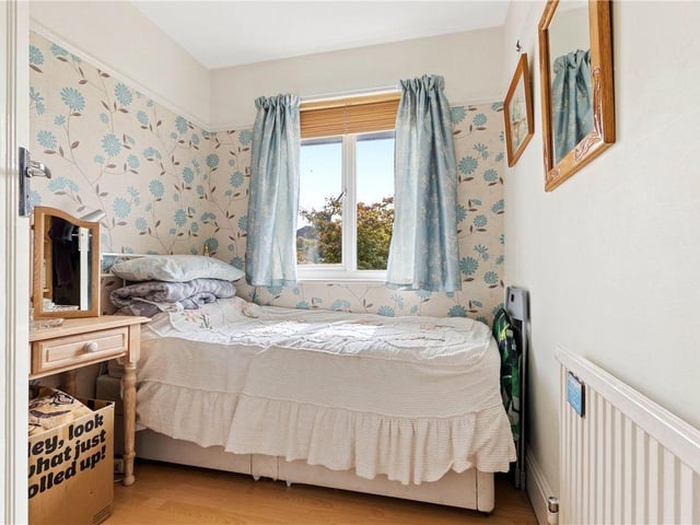 The detached property has four bedrooms.