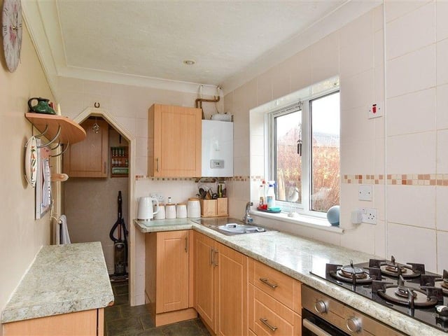 The kitchen overlooks the back garden