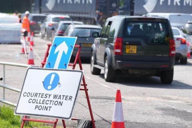 People flocked to s bottled water station set up in Billingshurst after the Horsham district was left with 'no water' back in May. Photo: Eddie Mitchell