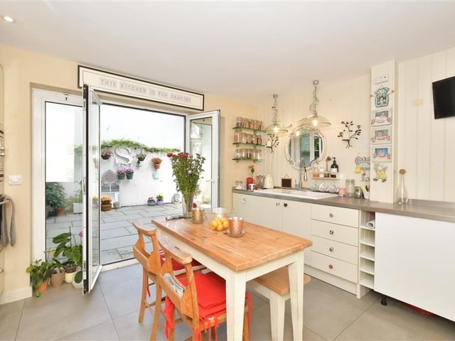 The kitchen leads out to the courtyard style garden.