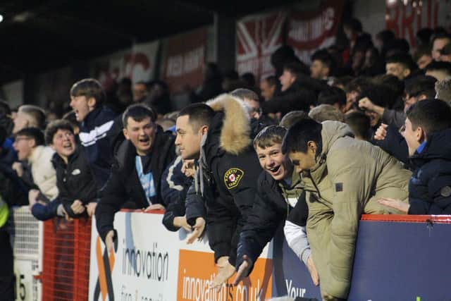 Crawley Town fans celebrate their late equaliser | Picture: Cory Pickford