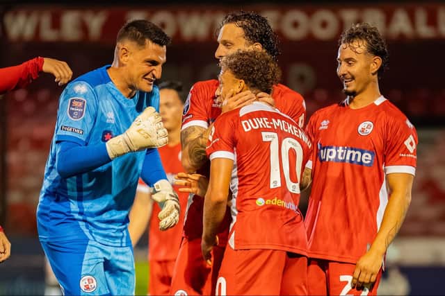 Vito Mannone celebrates with Stephen Duke-McKenna after one of his stunning strikes | Picture: Kyle Hemsley