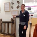 Claire Lucas, museum manager, with church gates made from wood that is nearly 1,000 years old