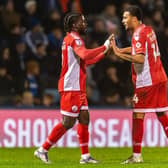 Kabby Tshimanga celebrates his equaliser at Gillingham with Louis Flower