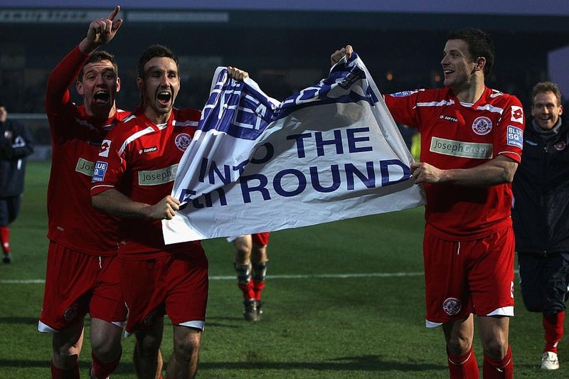 Crawley celebrate a win at Torquay United in 2011 than set up a glamour tie at Manchester United in the next round.