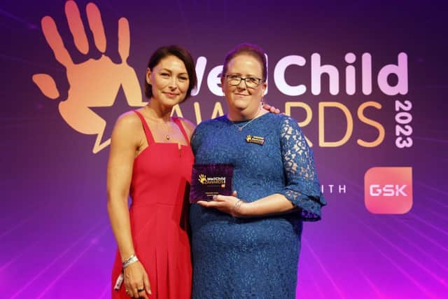 Hannah Lines from Chestnut Tree House Childrn's Hospice receives her Award from Emma Willis.