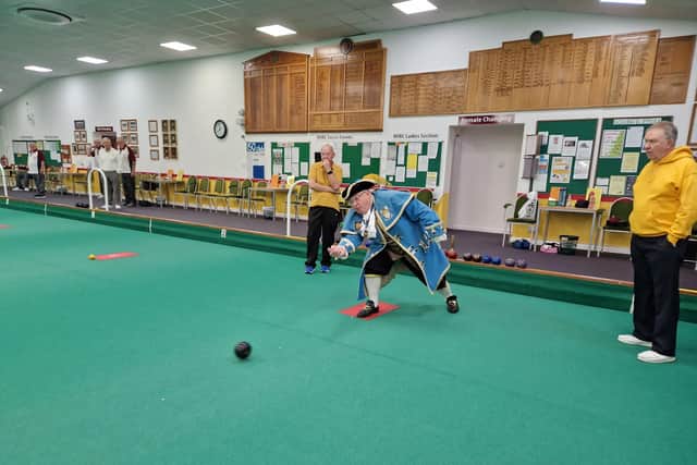 Worthing town crier Bob Smytherman bowls the first wood to start the 24-hour Bowlathon at Worthing Indoor Bowls Club for BBC Children in Need. Picture: Elaine Hammond