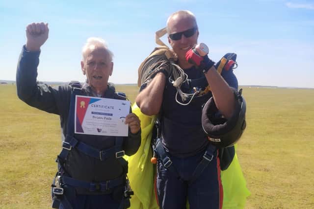 Brian Pate, 85, the oldest skydiver taking part, with his military instructor from the Army Parachute Association