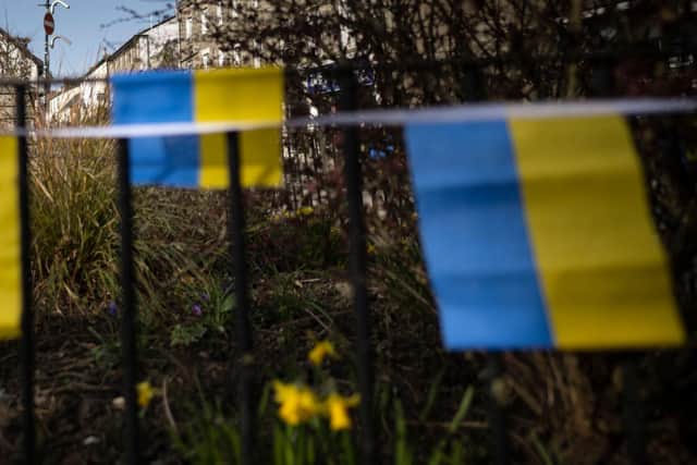 Ukrainian flag bunting (Photo by BEN STANSALL/AFP via Getty Images)