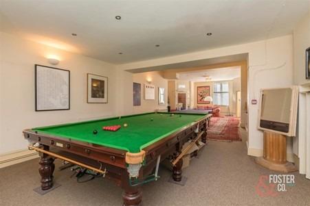 Full size snooker table featured.
