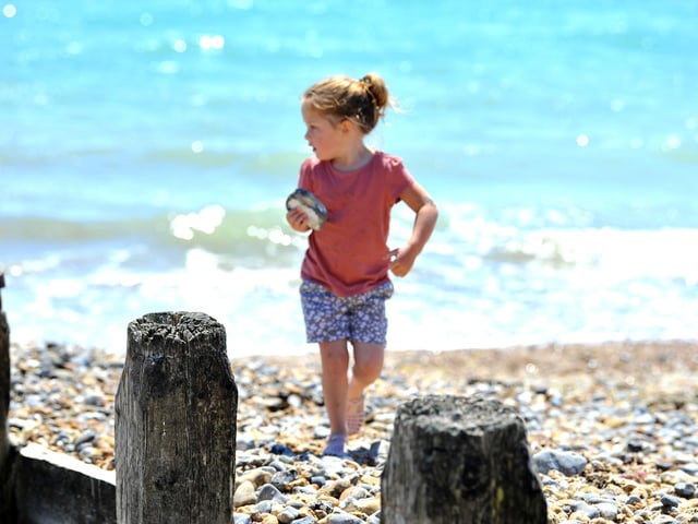 Enjoying the heatwave on Worthing beach. Pic S Robards SR2206152