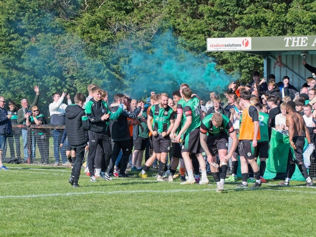 Burgess Hill Town players, fans and staff celebrate surviving in the Isthmian south east division at the end of their 0-0 draw with Beckenham