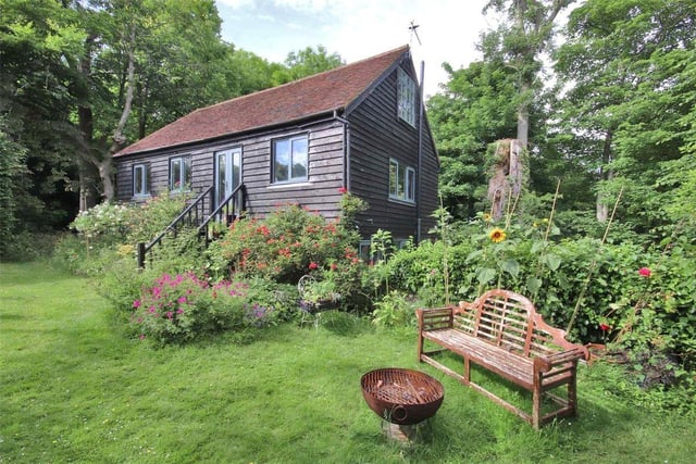 'Accessed via a separate driveway and well-screened from the main house is Wood Barn, a three-bedroom cottage with first floor kitchen/sitting room.'