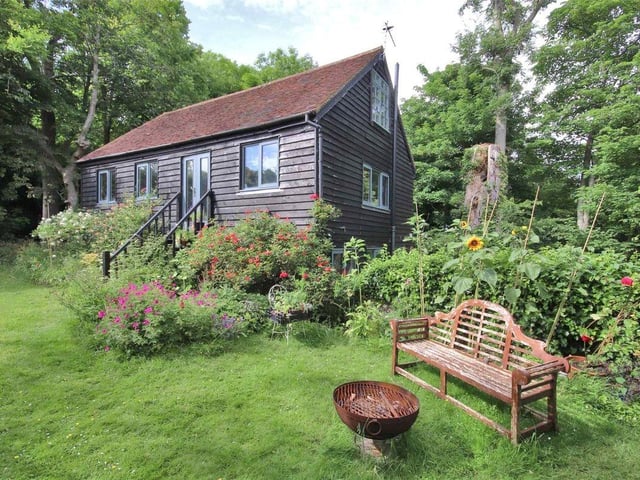 'Accessed via a separate driveway and well-screened from the main house is Wood Barn, a three-bedroom cottage with first floor kitchen/sitting room.'