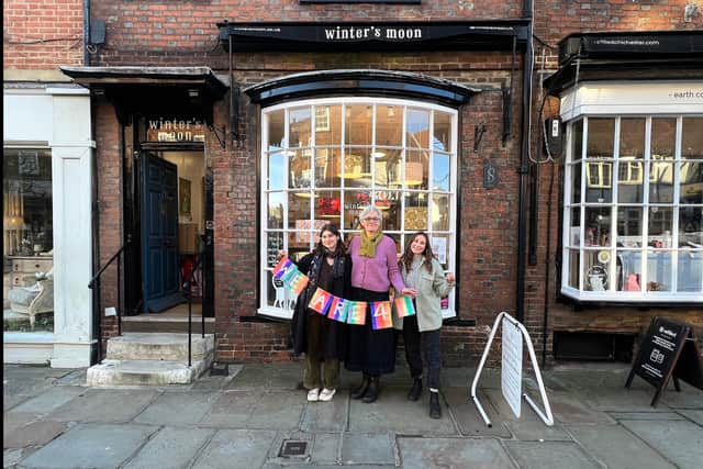 Owner Julia Grant and staff outside their shop on Chichester's high street.