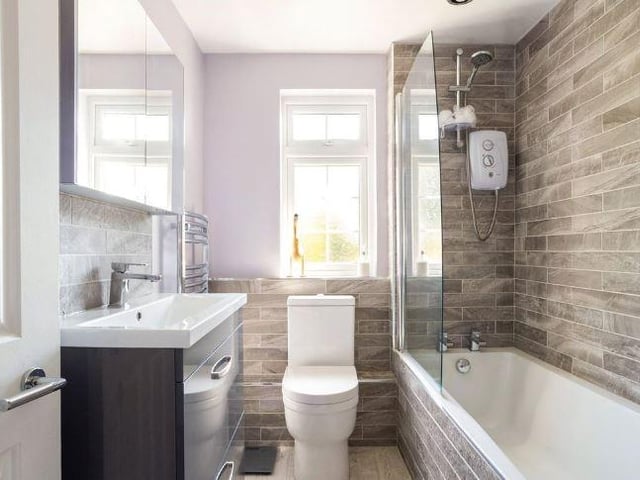 The bungalow has two bathrooms (one ensuite), a separate wc, abd utility room