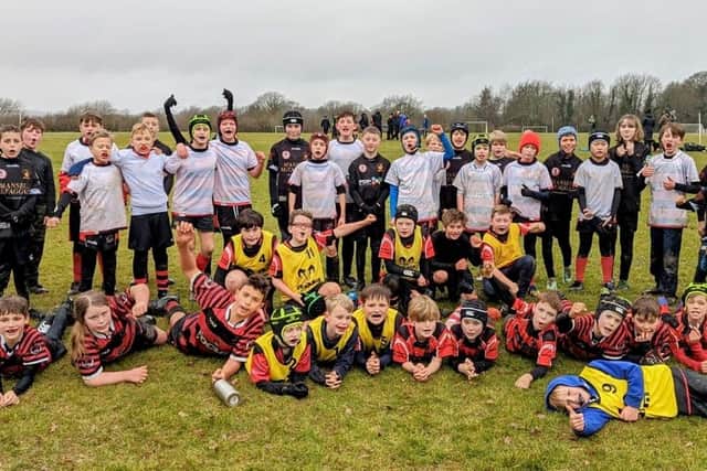 Young rugby players take a training break at Haywards Heath