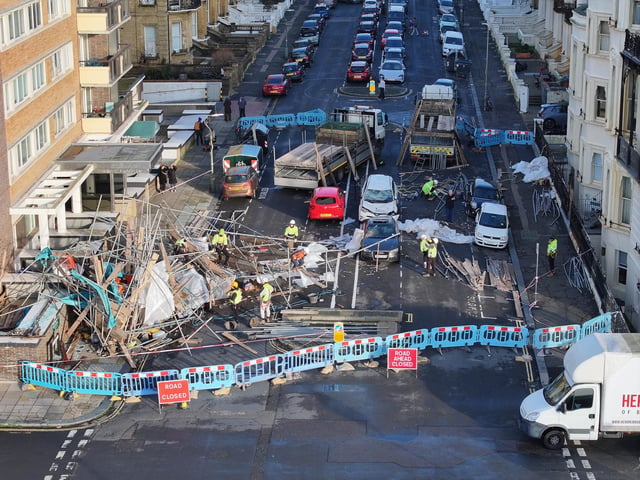 Everyone escaped unharmed after scaffolding collapsed onto a road in Hove – with clear-up works continuing the next day.