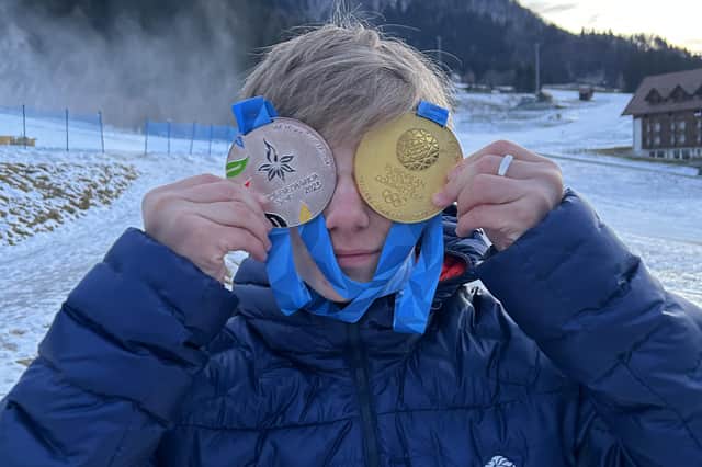 Charlie Lane of Steyning shows off his two medals