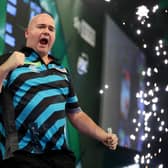 Rob Cross celebrates winning his quarter final match against Chris Dobey at Alexandra Palace (Photo by Tom Dulat/Getty Images)