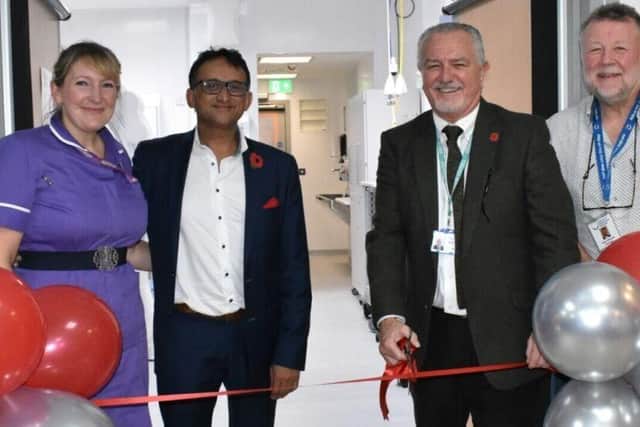 East Sussex Healthcare Trust Chairman, Steve Phoenix, cuts the ribbon to officially open the new cath lab. Picture: East Sussex NHS Trust
