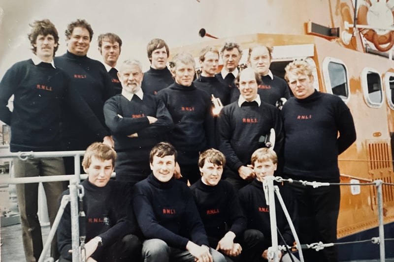 Newhaven Lifeboat crew, 1985. Featured top row, left to right: Andrew McQueen, Chris Bird, Mike Beach (Mechanic), Steve Kent, Ian Johns, Derek Payne, Paddy Boyle (Second Coxswain). Middle row, left to right: Len Patten (Coxswain), Tony Jefferies, Brian Ashdown (Second Mechanic), Rick Ward. Front row, left to right: Paul Legendre, Phill Corsi, Lol Deakin and Nick Gentry.