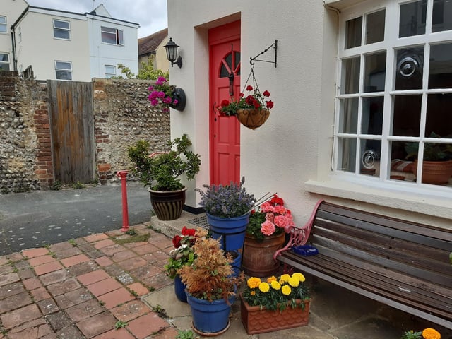 Floral splendour at Brunswick Cottages, a tiny courtyard of four fishermen's houses off the twitten that marks the historic boundary between Worthing and Heene