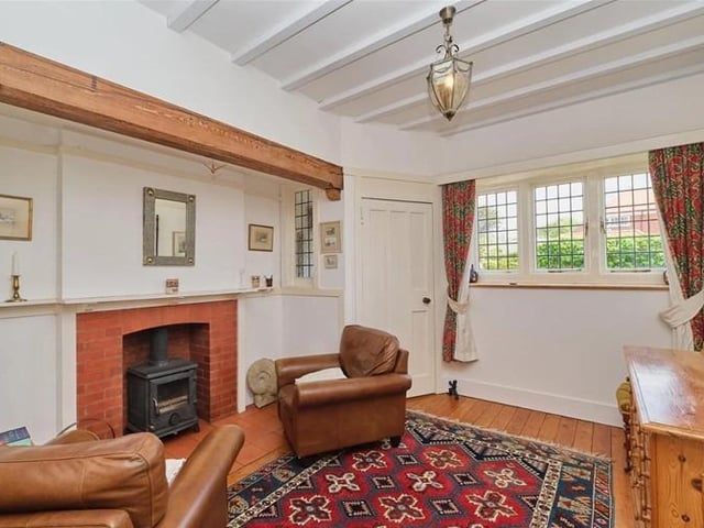The reception hall features a working wood burner and space for seating.