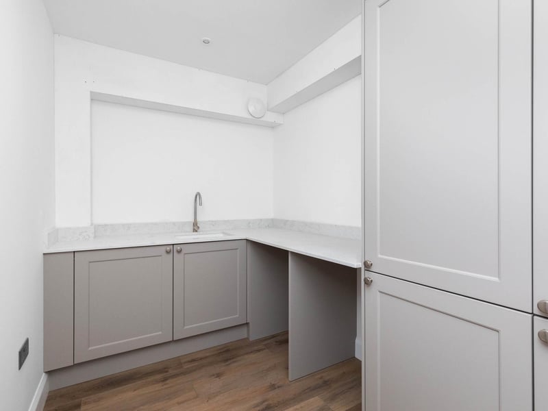 The home has a utility room with space and plumbing for laundry facilities
