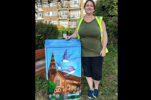 Artist Holly Sellors' with her design on the St John’s Road box on the corner with Church Close, Burgess Hill