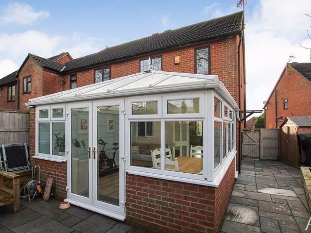 This view from the rear of the £195,000 property shows the conservatory and also the space at the side of the house.