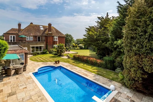 The house is on the market with Hamptons - Brighton & Hove Sales for a guide price of £2,950,000.
Dating back to the 1930s with later editions it has been in the same family for over 40 years. The landscaped rear gardens are a particular feature of the property, laid out on two levels; the outdoor swimming pool is sited on the top level, enjoying views to the south, and has a paved surround with plenty of space for sun loungers