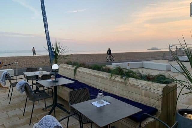 The outside seating area of Bayside Social has a stunning view of Worthing beach