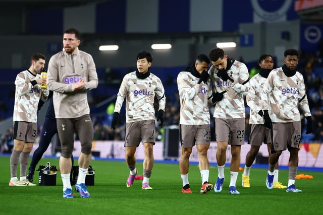 Son Heung-Min looks on as Pedro Porro and Brennan Johnson of Tottenham Hotspur speak with each other as they warm up prior to the Premier League match between Brighton & Hove Albion and Tottenham Hotspur at American Express Community Stadium. (Photo by Bryn Lennon/Getty Images)