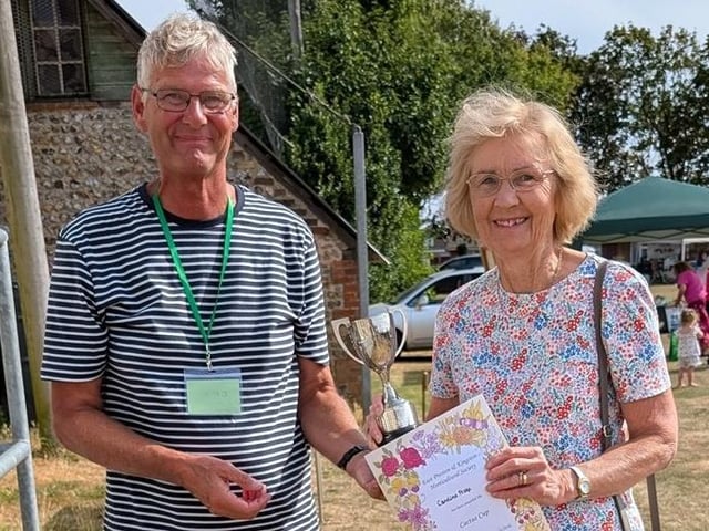 Caroline Frake being presented with the Cactus Cup by chairman Chris Hill