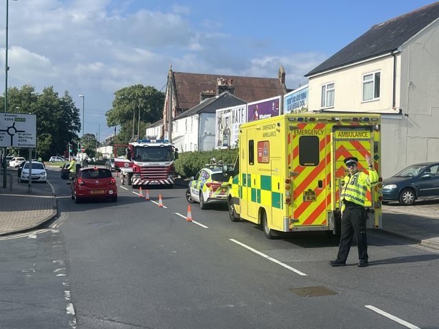 Two people taken to hospital after car collides with building in West Sussex
