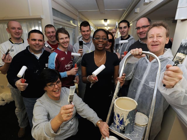 Store managers from Tesco Extra in Worthing, when it was new in January 2010, painting the corridors of the St Barnabas House hospice in Columbia DriveW03252h10