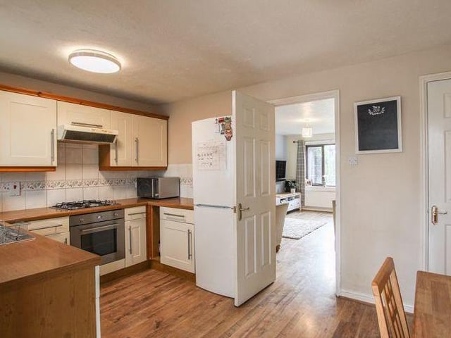 A second look at the kitchen/diner, which is sandwiched between the living room and the conservatory on the ground floor. There is space for a table and chairs for meals.