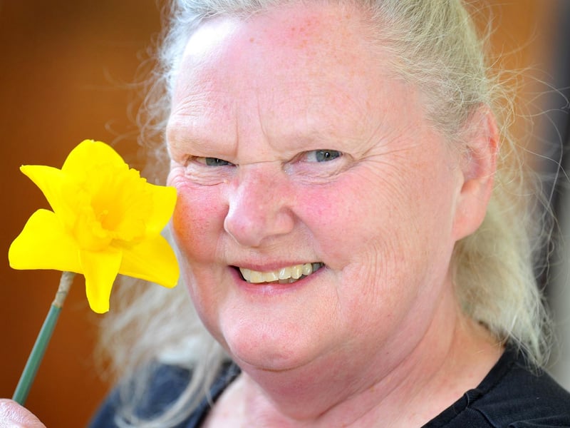 Sue Goodsall, show manager, with one of her first place daffodils