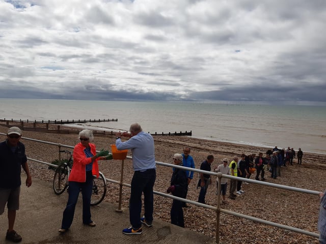 A bucket chain of volunteers from Ferring History Group and Ferring Conservation Group, including Worthing West MP Sir Peter Bottomley, form a bucket chain to bail out nine inches of water from the Ferring pillbox