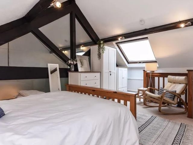 Exposed beams give this bedroom a distinct sense of character.