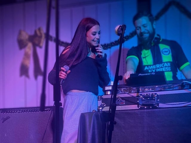 Lily Wolfe performing rap.
