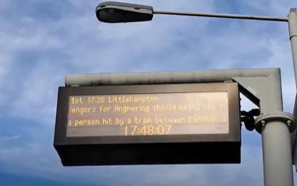 A train platform sign announces the incident between Portsmouth Harbour and Barnham