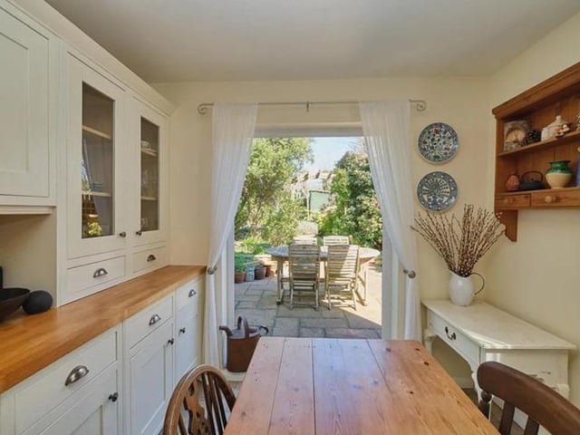 The dining room over looks and opens onto the rear garden, whilst the dual aspect 22' kitchen diner has matching wall and base cupboards, work surfaces, integrated appliances and French doors which also lead onto the rear garden.