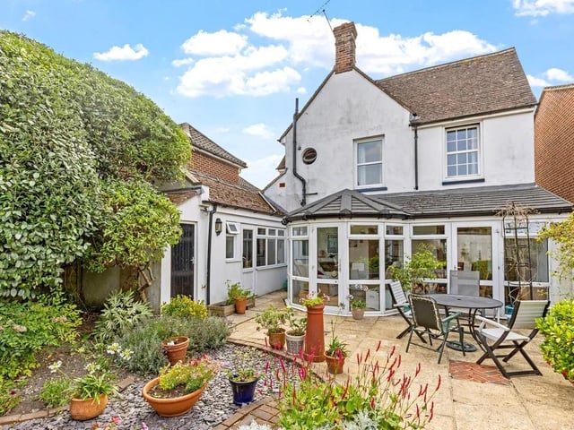 The back garden patio is a perfect space for entertaining guests.