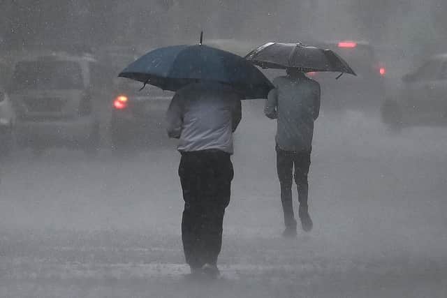 A spell of rain – ‘heavy at times’ –  will affect London and South East England later this afternoon (Wednesday, September 20) and into the early hours of Thursday. (Photo by ARUN SANKAR/AFP via Getty Images)