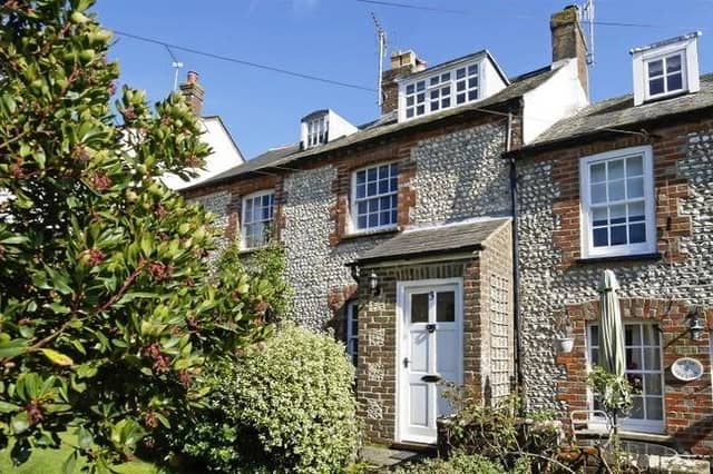 This charming flint cottage is in a picturesque position with views of Arundel Cathedral