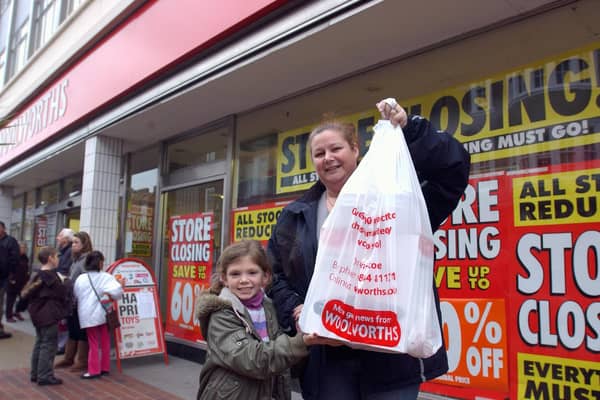 Tracey Chorley and her daughter Caitlin, ten, with their bargains, outside Woolies in Bognor in December 2008