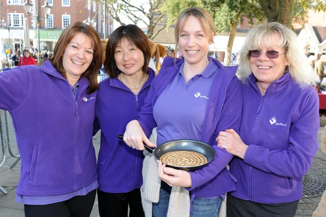 JPCT 190213 S13081392x  Horsham Rotary charity pancake races in the Carfax.  Spofforths team -photo by Steve Cobb
